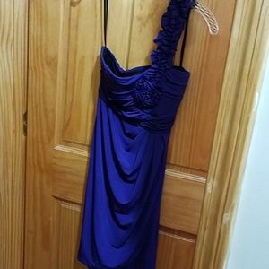 Off the shoulder purple dress.